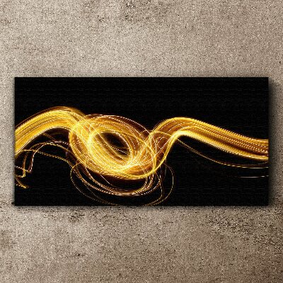 Obraz Canvas Złote smugi światła na czerni