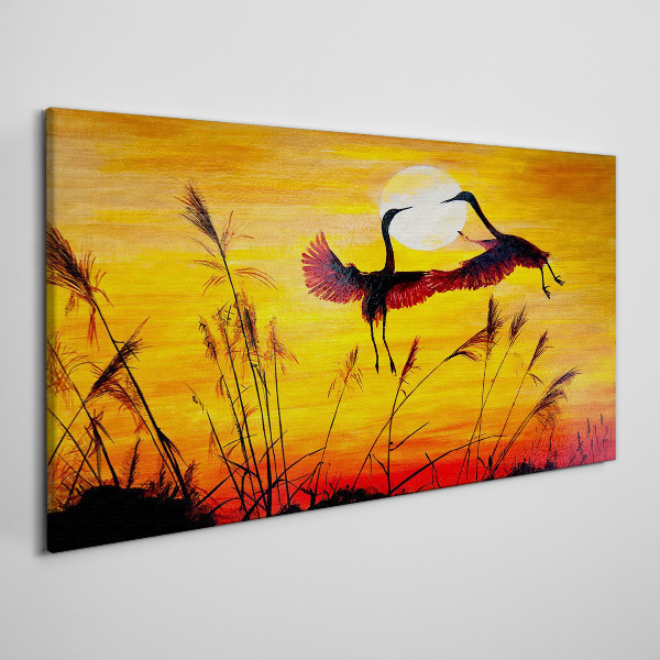 Obraz Canvas Tańczące żurawie przy zachodzie słońca