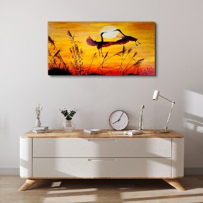Obraz Canvas Tańczące żurawie przy zachodzie słońca
