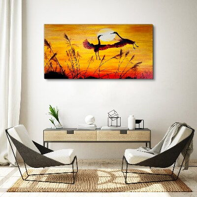 Obraz Canvas Tańczące żurawie przy zachodzie słońca