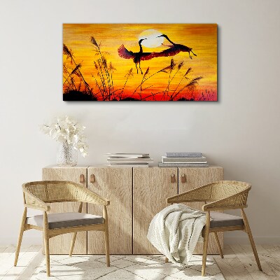 Obraz Canvas Tańczące żurawie przy zachodzie słońca