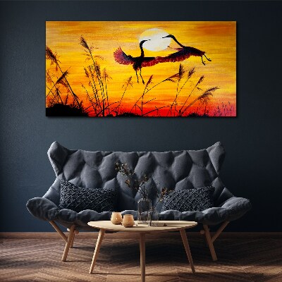 Obraz Canvas Tańczące żurawie przy zachodzie słońca