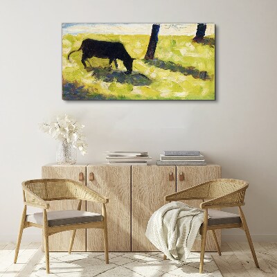 Obraz Canvas Pasąca się krowa w zielonym krajobrazie