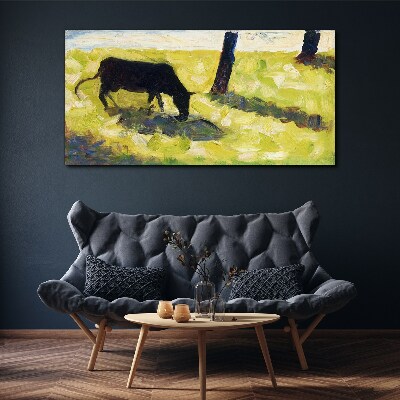 Obraz Canvas Pasąca się krowa w zielonym krajobrazie