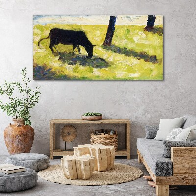 Obraz Canvas Pasąca się krowa w zielonym krajobrazie