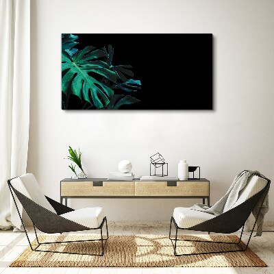 Obraz Canvas Zielone liście na czarnym tle