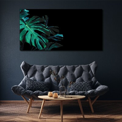 Obraz Canvas Zielone liście na czarnym tle