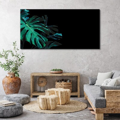 Obraz Canvas Zielone liście na czarnym tle