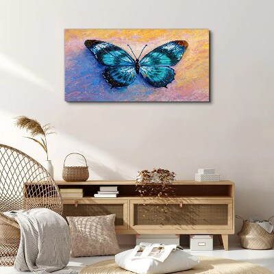 Obraz Canvas Błękitny motyl na pastelowym tle