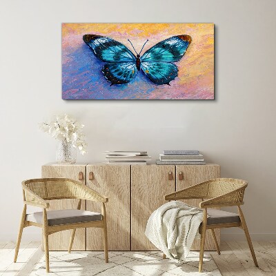 Obraz Canvas Błękitny motyl na pastelowym tle