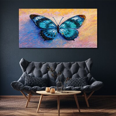 Obraz Canvas Błękitny motyl na pastelowym tle