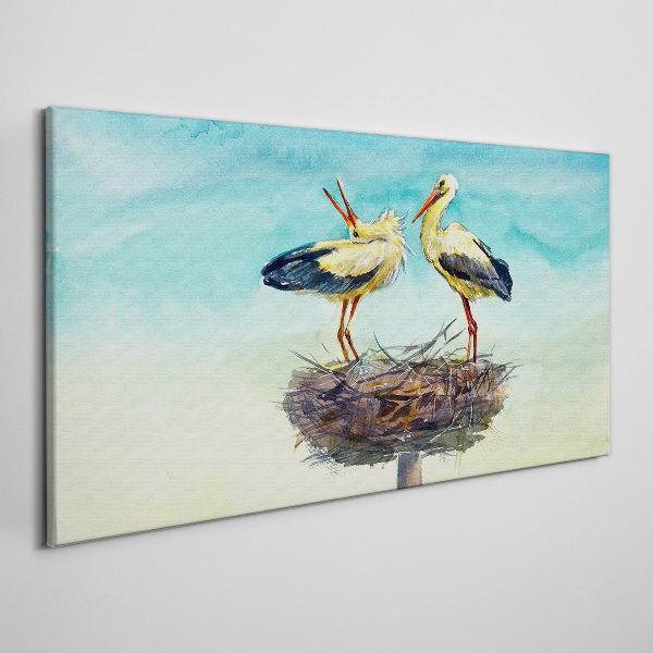 Obraz Canvas Storki na gnieździe w błękicie