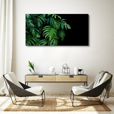 Obraz Canvas Zielone liście na czarnym tle