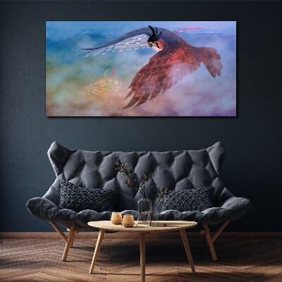 Obraz Canvas Lot drapieżnego ptaka w chmurach