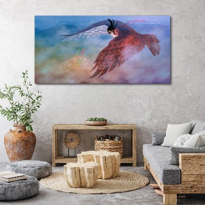 Obraz Canvas Lot drapieżnego ptaka w chmurach